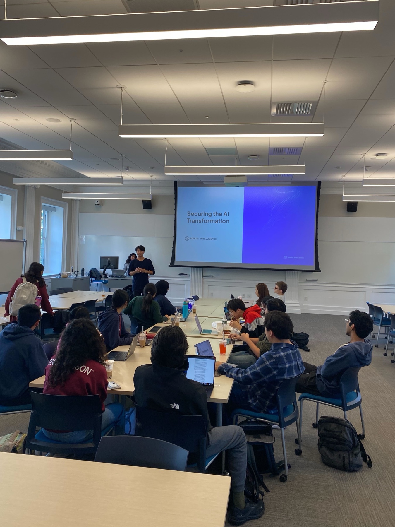 A Robust Intelligence speaker presenting on securing AI systems